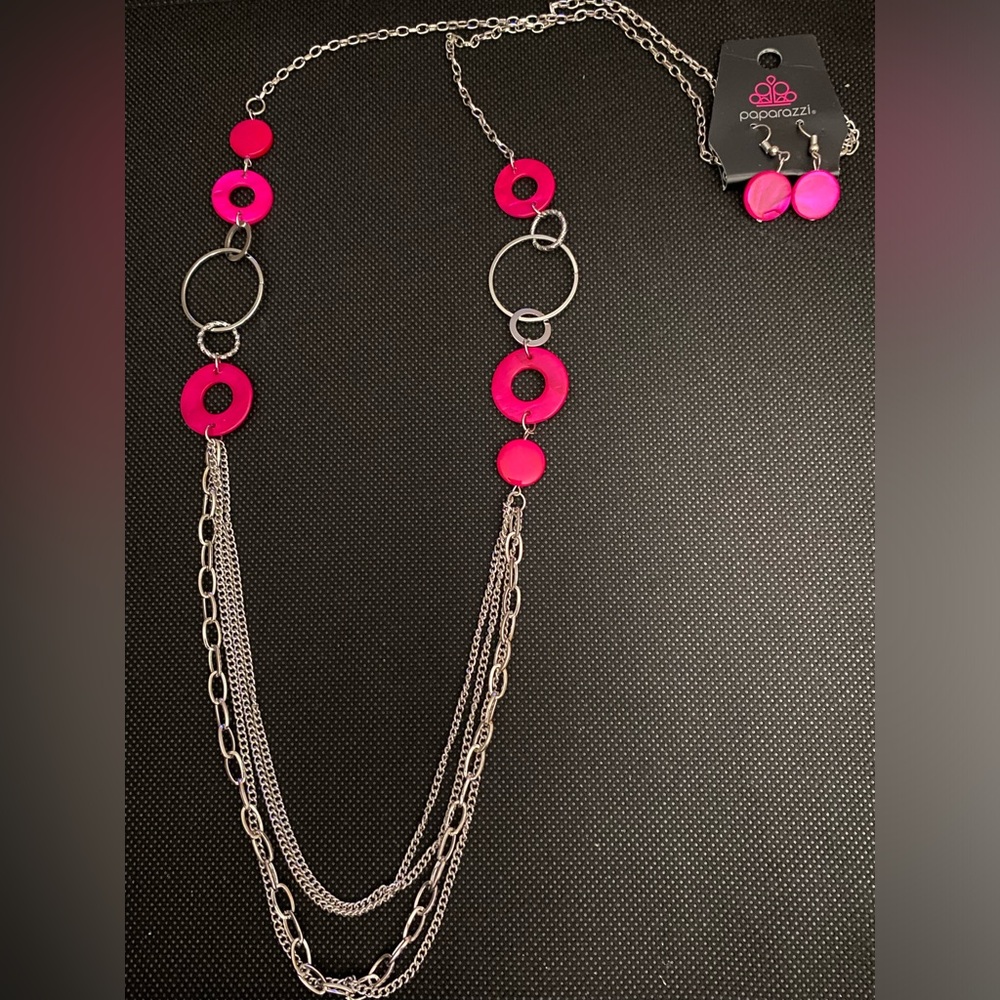 *Long silver and pink acrylic multi layered necklace.